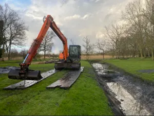 Digger dredging riverbed silt