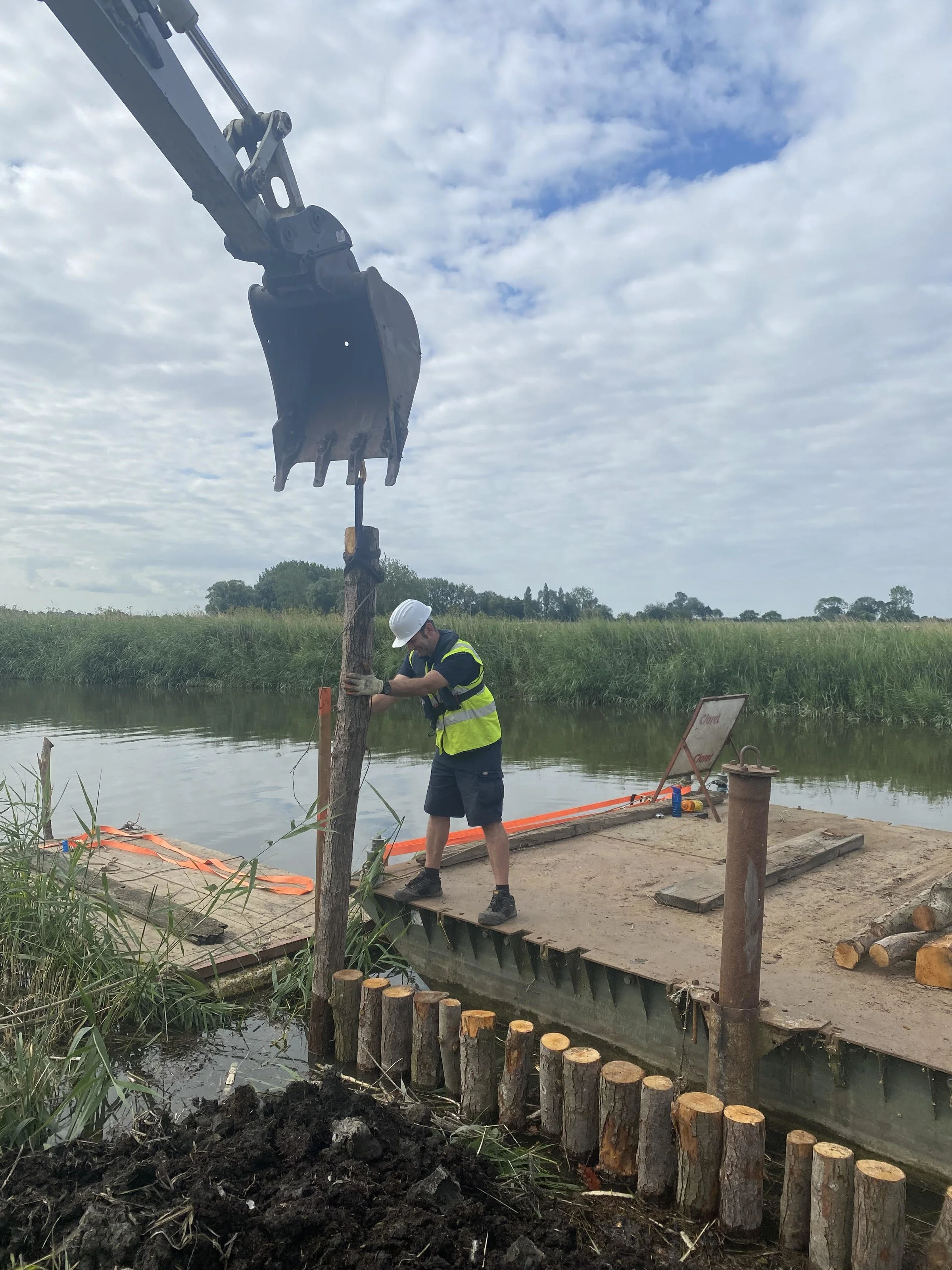 man setting rig for weed wacking